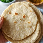 almond flour tortillas arranged on a table with garnishes and olive oil